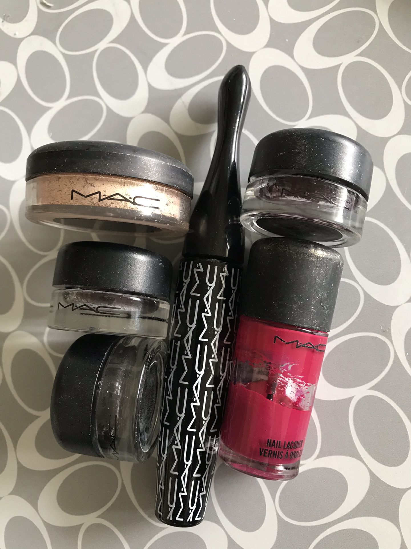 6 empty trade-in MAC containers