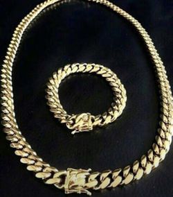 New 14 k yellow gold Cuban chain and bracelet