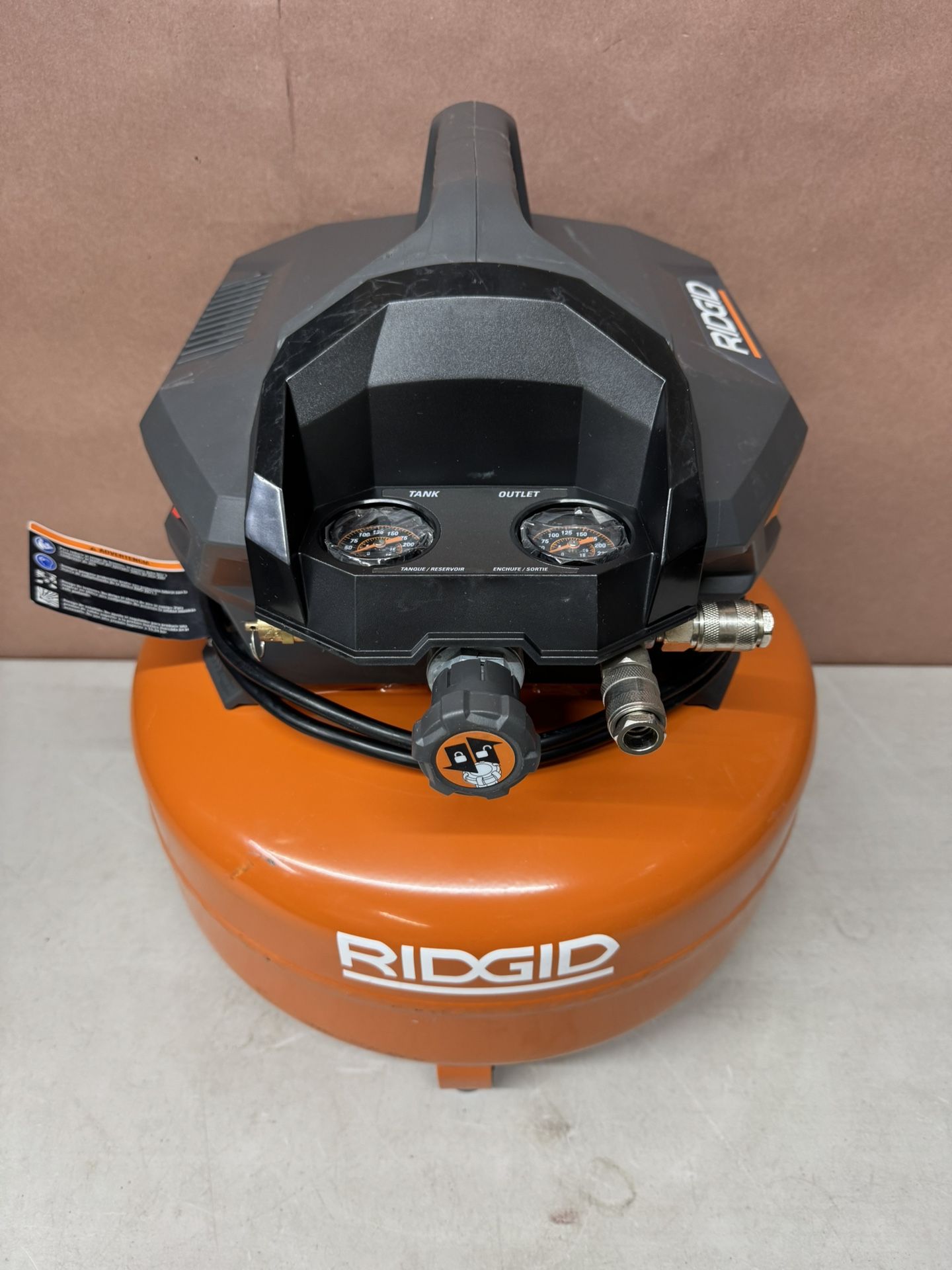 RIDGID 6 Gal. 150 PSI Portable Electric Oil-Free Jobsite Pancake Air Compressor with Dual Pressure Gauges and 2-Quick Couplers