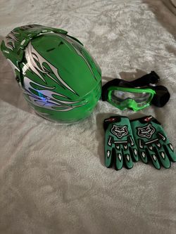 Kids dirt bike helmet, goggles and gloves.