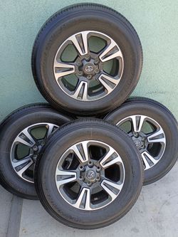 Toyota OEM Wheels with Toyo Open Country H/T Tires – Set of 4