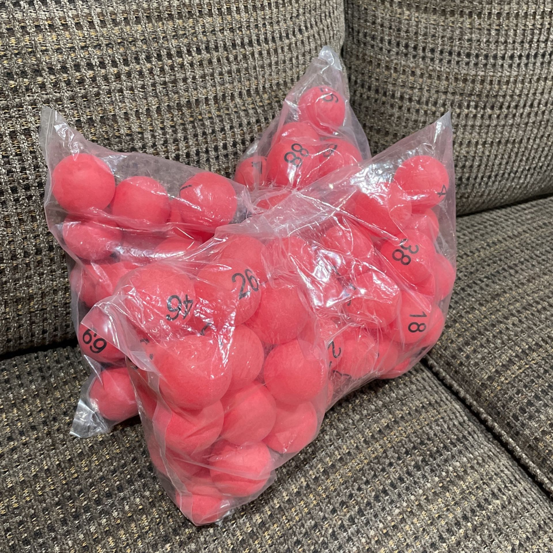 Two Large Bags Of Plastic Bingo Balls .