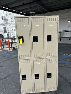 Tennsco double-tier industrial lockers feature a sand-colored finish and a recessed handle design