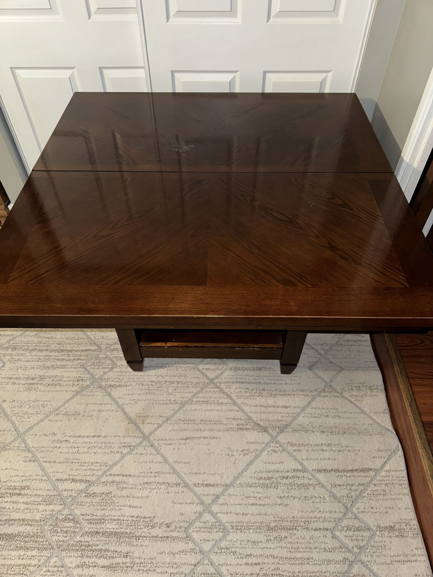 Hard wood table and leaf with 4 chairs storage underneath table