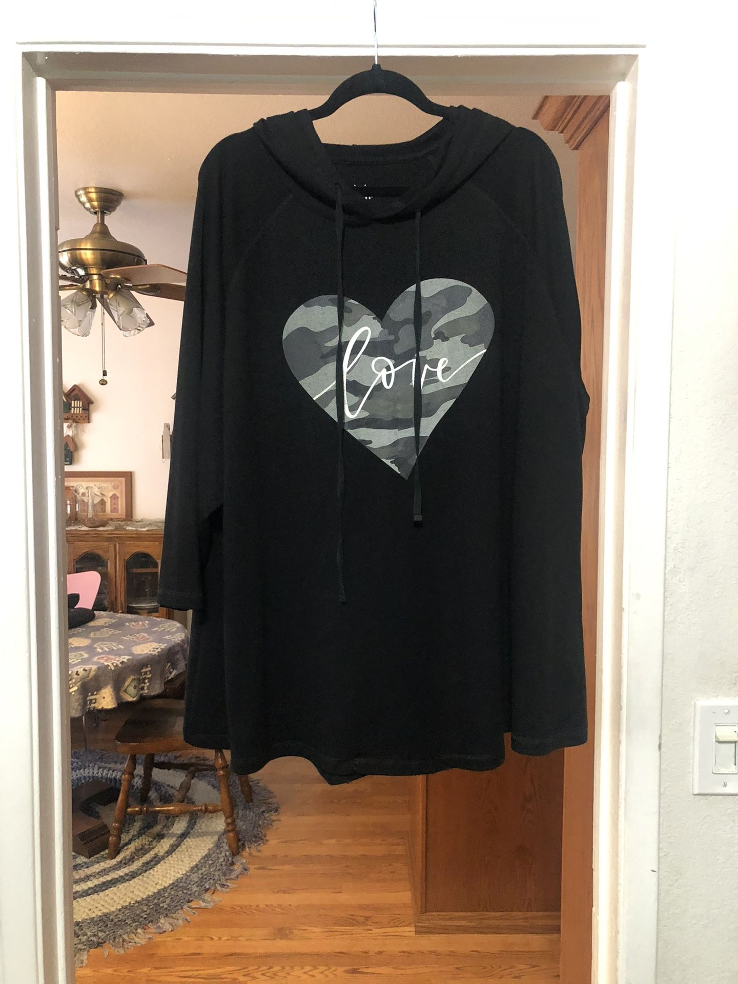 Women’s Size 26 / 28 Hooded Tunic Length 3/4 Length sleeves.  Color Black the front has a heart says “Love”.  Made of 70% Viscose, 26% Polyester and 4