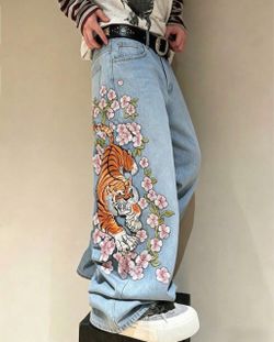 Size 42 (XL) baggy Denim jeans with embroidered/ stitched in Sakura tree blossoms and tiger.