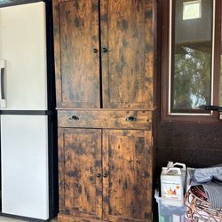 IRONCK kitchen pantry cabinet featuring a rustic brown engineered wood finish