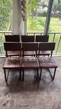 Six camel brown chairs