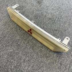 Mitsubishi Eclipse 1G Center Park Lamp Emblem