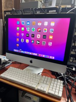 Apple iMac retina 4k 21.5-inch Late 2015 with a slim aluminum body and built-in display. Powered on and running macOS Monterey. 16GB RAM 256GB SSD NO