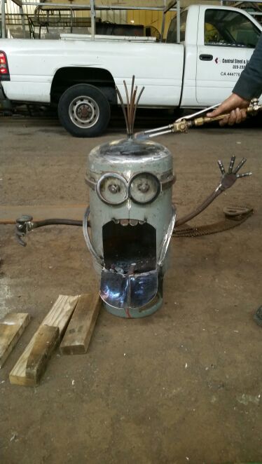 hand cut art fire pit minion made from recycled propane tank