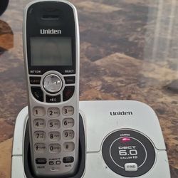 Uniden DECT1560 cordless phone with power cord and phone cord