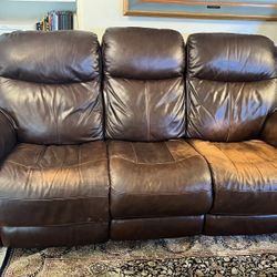 Comfortable brown leather reclining sofa in good condition. 