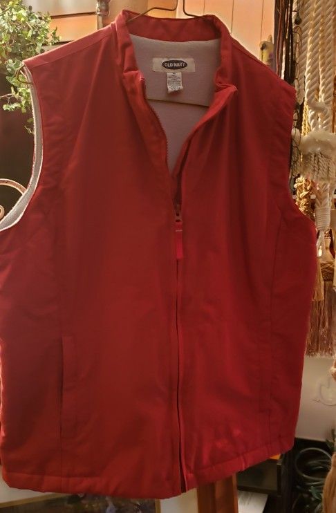 Old NAVY RED VEST WITH COTTON LINER. ZIPS CLOSE SIZE MEDIUM
