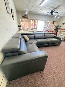 NEVIO - 4 pc top smoke grey leather sectional w/2 power recliners and articulating headrest