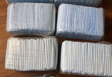 Disposable Bed Pads with Adhesive Strips 30 x 36 in Counts 28. Each  Bag 5$ I have 4 Bags