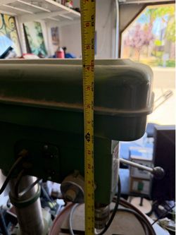 Heavy dusty vintage drill press.