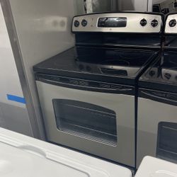 GE 4 Burner Glass Top Black And Stainless Steel Range. 1 Year Warranty 