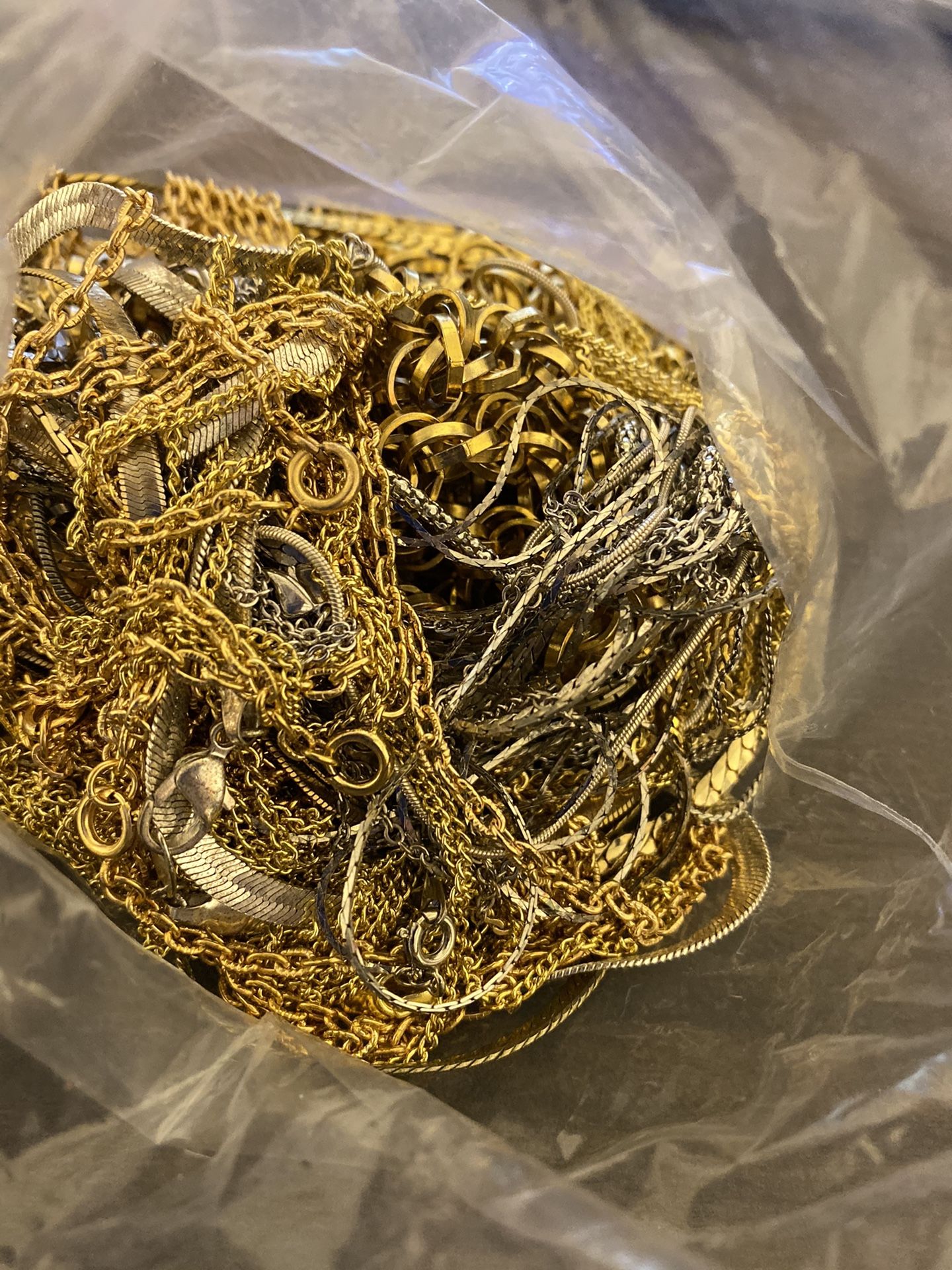 Bag of necklaces gold and sliver tone