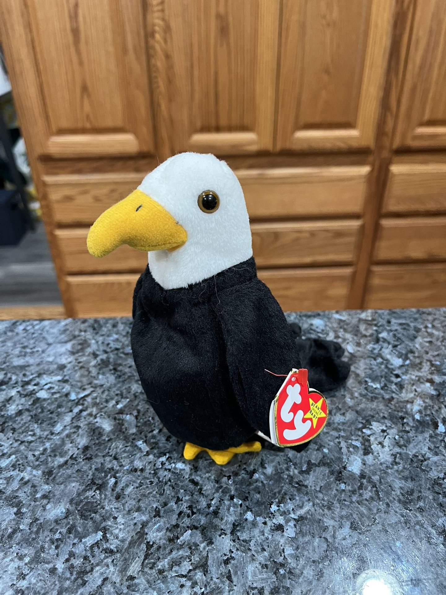 Ty Beanie Babie “Baldy” . Year 1996. Size 7 inches tall. Sits up. Brand New with Tags.