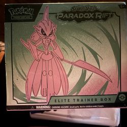 The image shows a Pokémon Trading Card Game (TCG) Scarlet & Violet—Paradox Rift Elite Trainer Box featuring the Pokémon Iron Valiant.