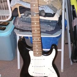 Electric Squire Mini Guitar By Fender With Stand