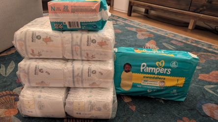 Huggies & Pampers Diapers - size newborn and 1