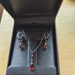 Pear-Shaped Garnet and Diamond Accent Pendant and Earrings Set in Sterling Silver and 14K Gold
