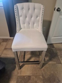 White Chair with Decorative Ring on Back