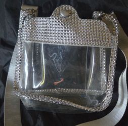 clear stadium-approved crossbody bag features sparkling silver rhinestones