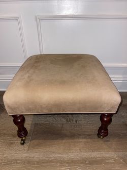 Upholstered Ottoman with Turned Wood Legs