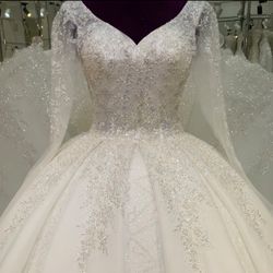 Wedding dress With matching long Veil.