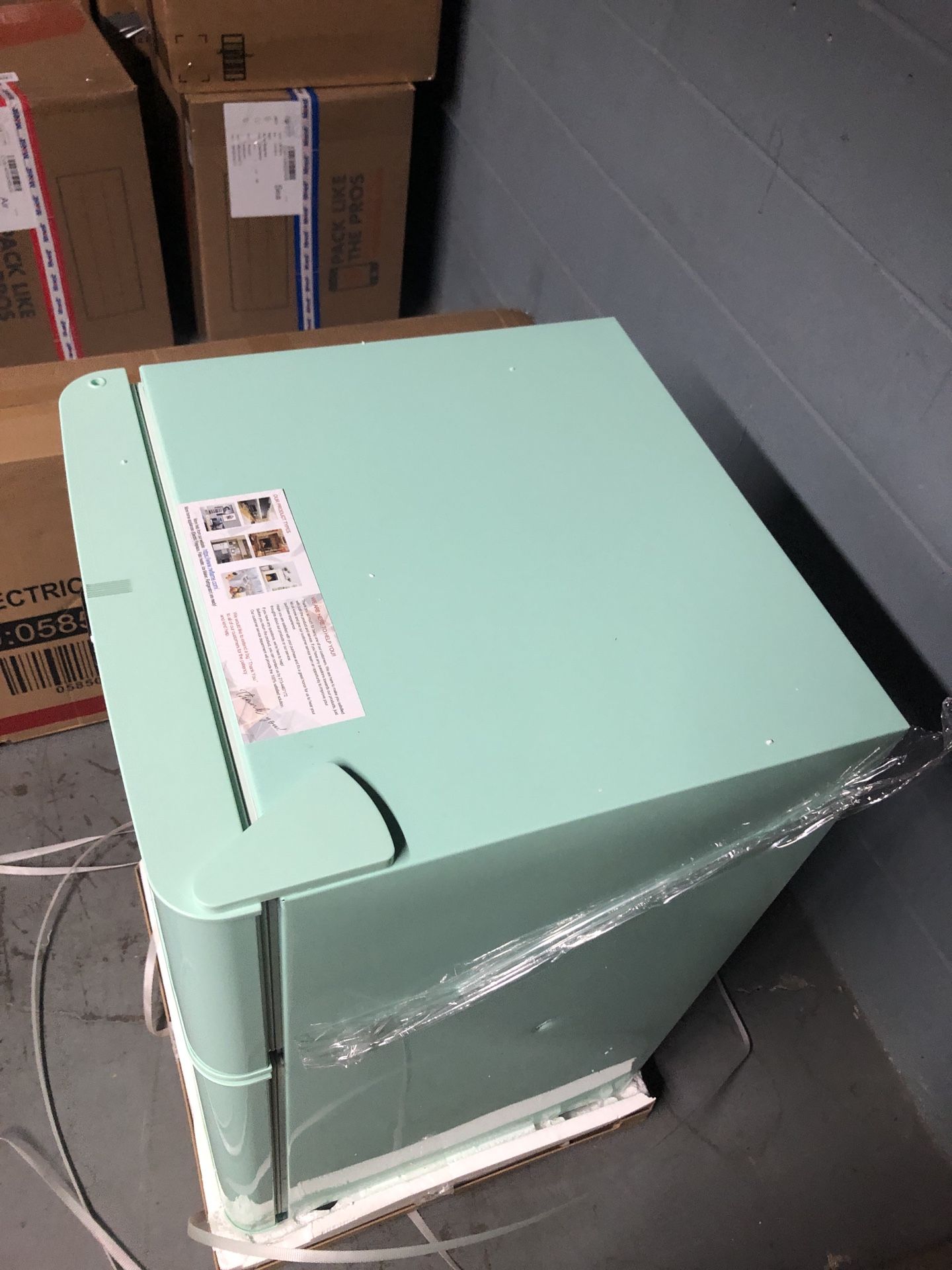 Compact Mini Refrigerator with Separate Freezer in the box with small dent on one side