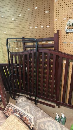 Dark brown wooden crib