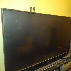 Old Flat Big Screen TV With Glass Stand