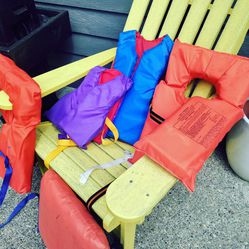 9 Life Jackets And One Seat Cushion 