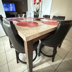 Counter height dining table and swivel chairs (6)