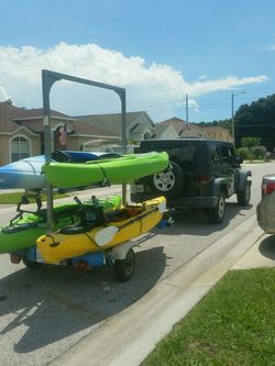 Kayak trailer with nine rod holders and storage locker. Like new condition.  for Sale in Tampa, FL - OfferUp
