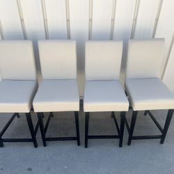 4 Upholstered counter-height Parsons bar stools