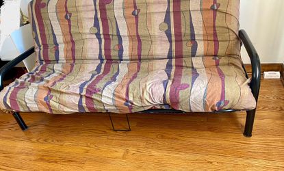 Futon . Reclines into bed..