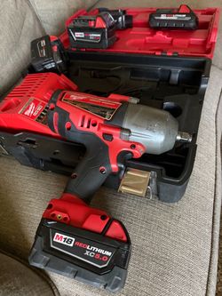 Milwaukee impact (batteries + charger)