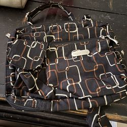 Baggallini crossbody bag featuring a distinctive black, brown, and beige geometric square pattern