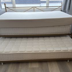Roll-out trundle bed frame (mattresses excluded)