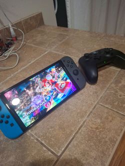 Nintendo Switch OLED/ Switch Pro controller/Mario Kart 8 (cartridge only) and SD card included