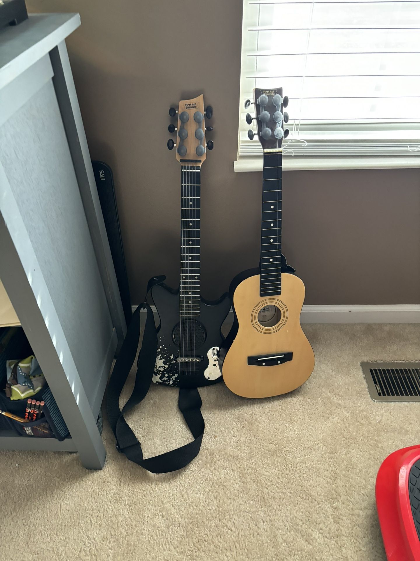 Guitars One Electric And One Has One String On It