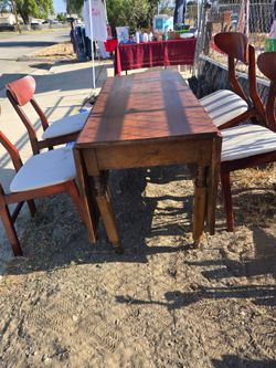 Wooden Drop-Leaf Dining Table with 4 Chairs. Chairs need to be clean