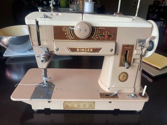 Singer 401A vintage sewing  machine - very clean but motor runs slow.  Sold As-Is.