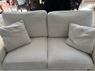 2  cream colored fabric couches