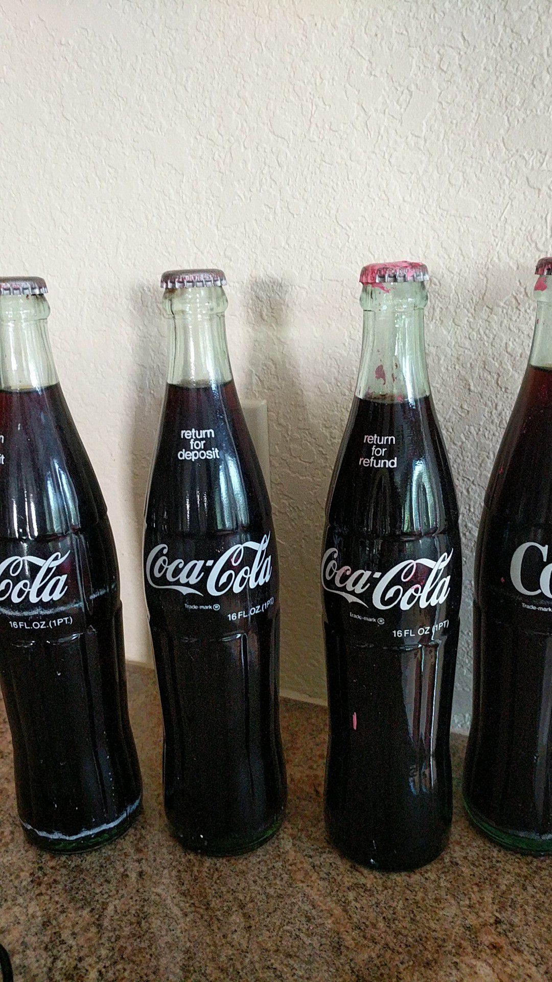 Four Vintage 16 oz. Coke Bottles