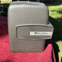 Vintage Bell & Howell Super 8 movie projector, model 346A, with 40 x 40” projector screen